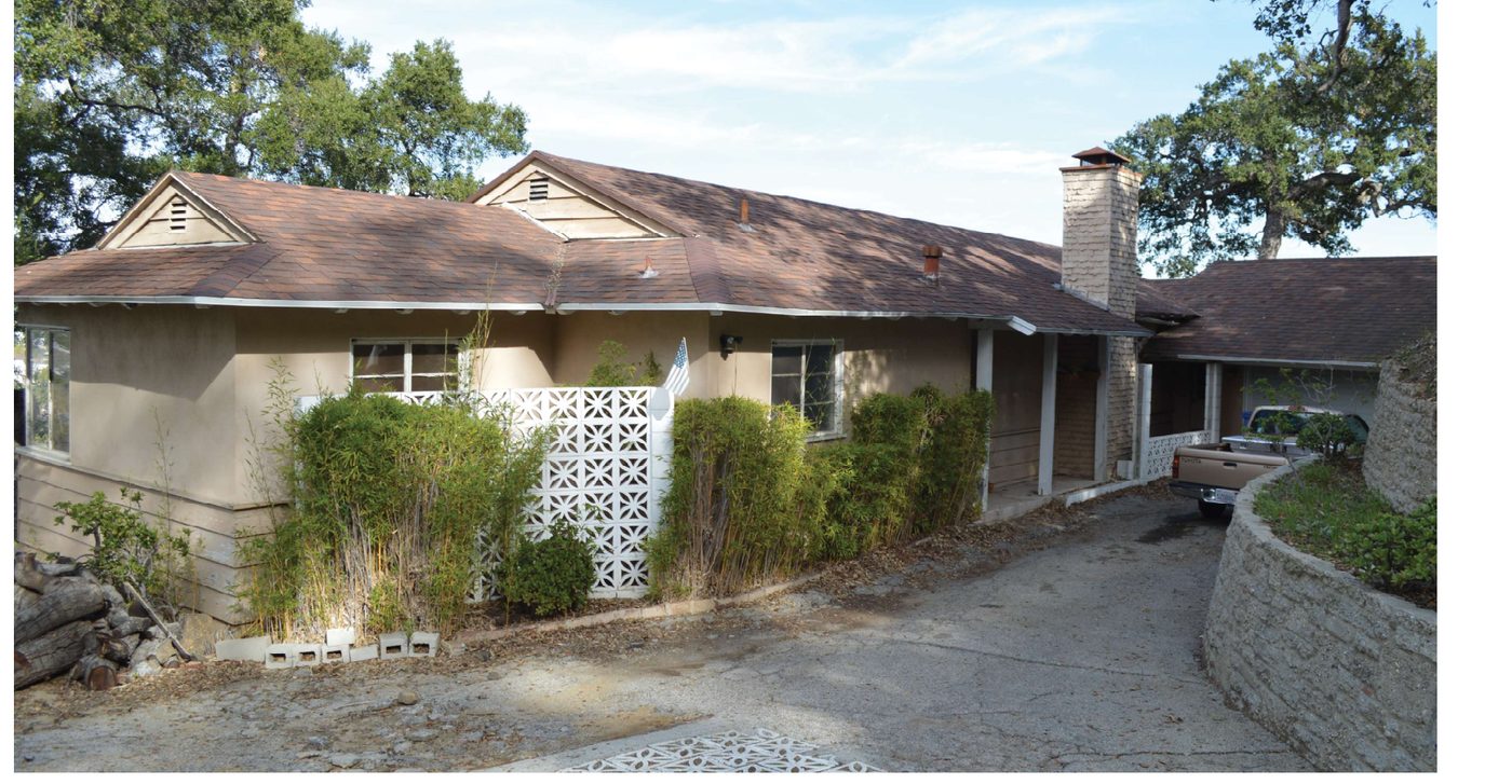 Original single-story ranch house before renovation
