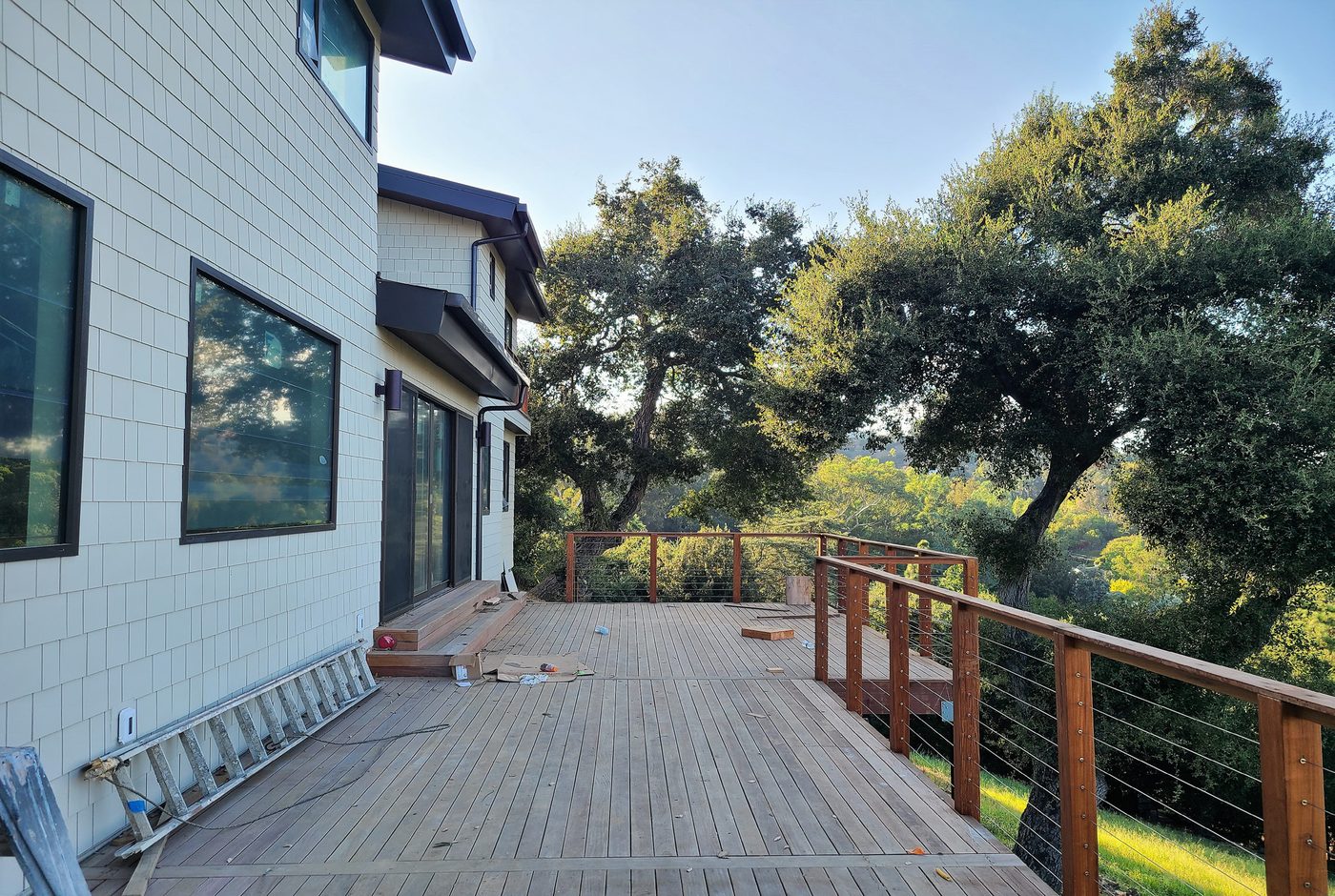 Overhanging timber deck with hillside views