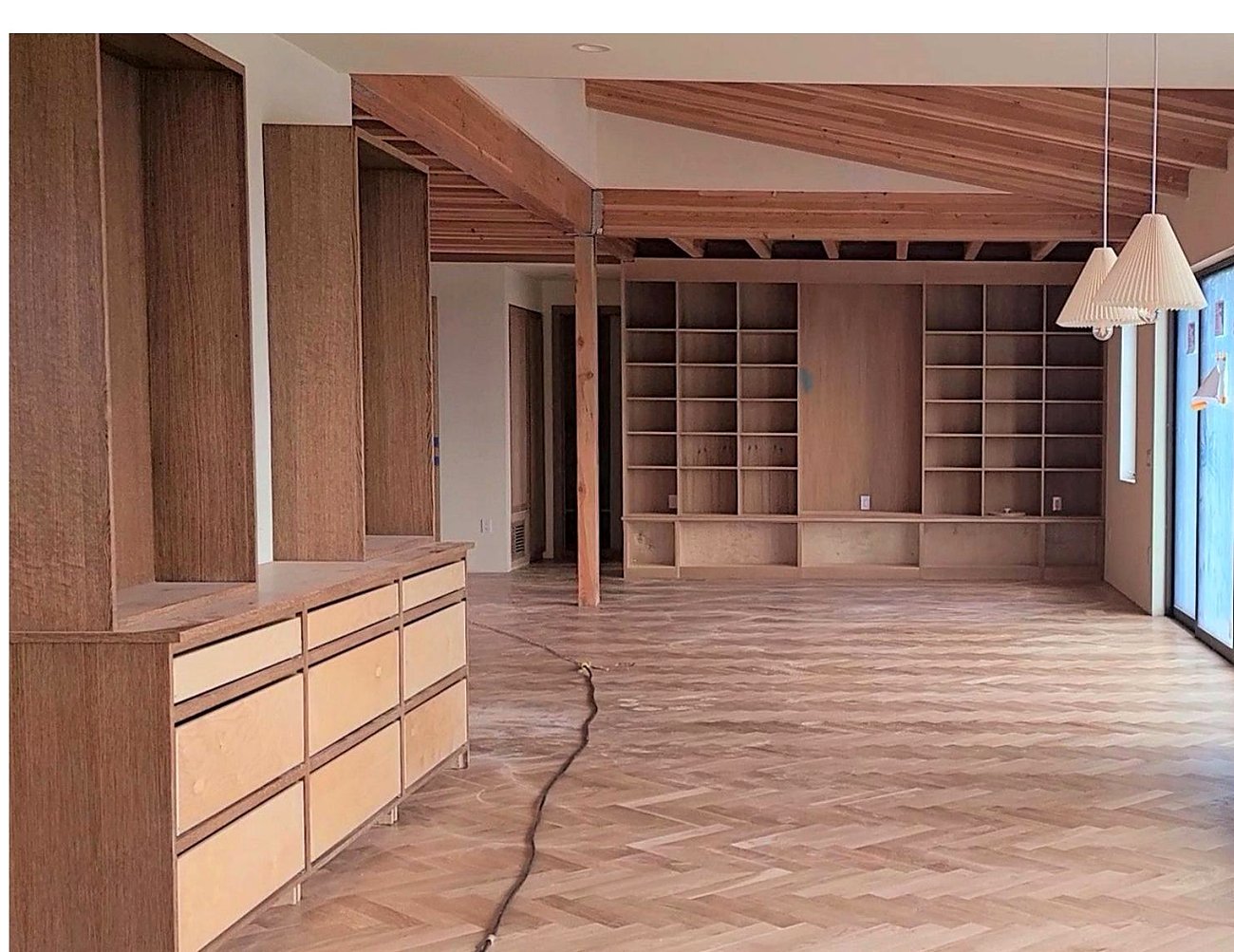 Library with built-in millwork and exposed beams