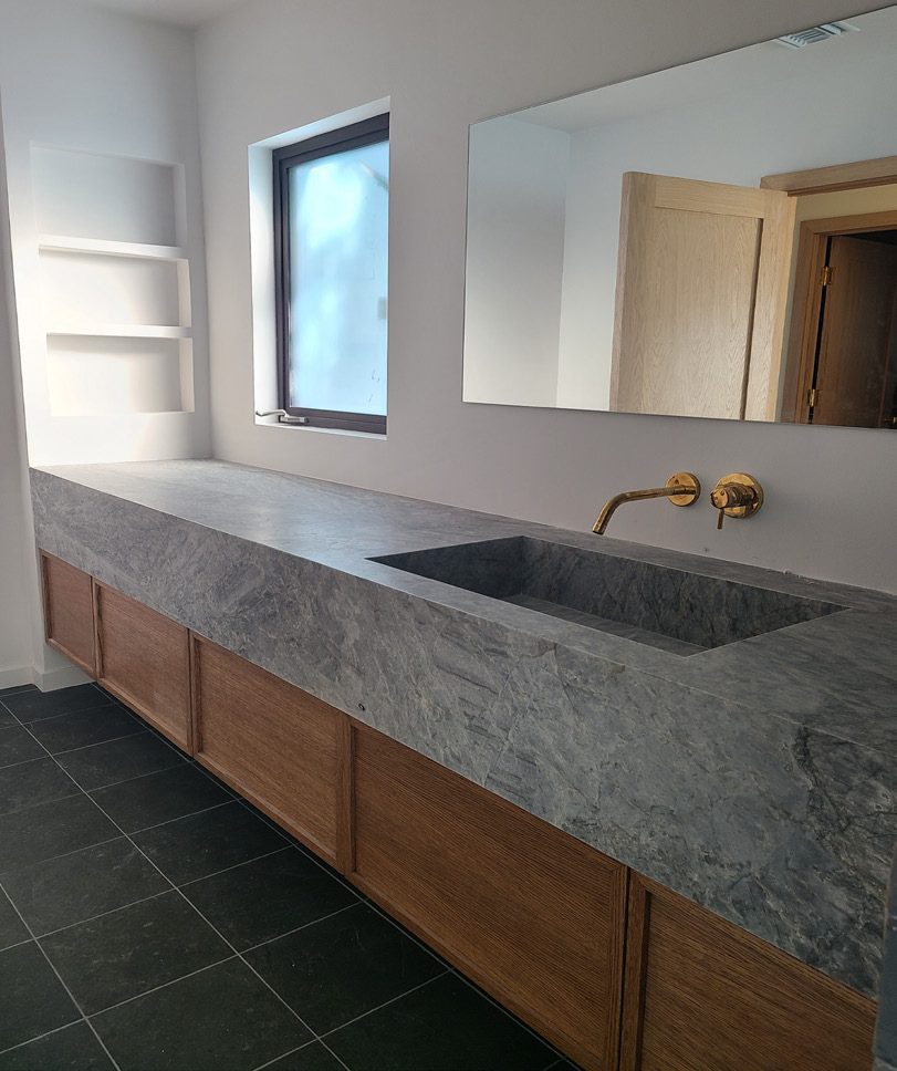 Custom stone trough vanity