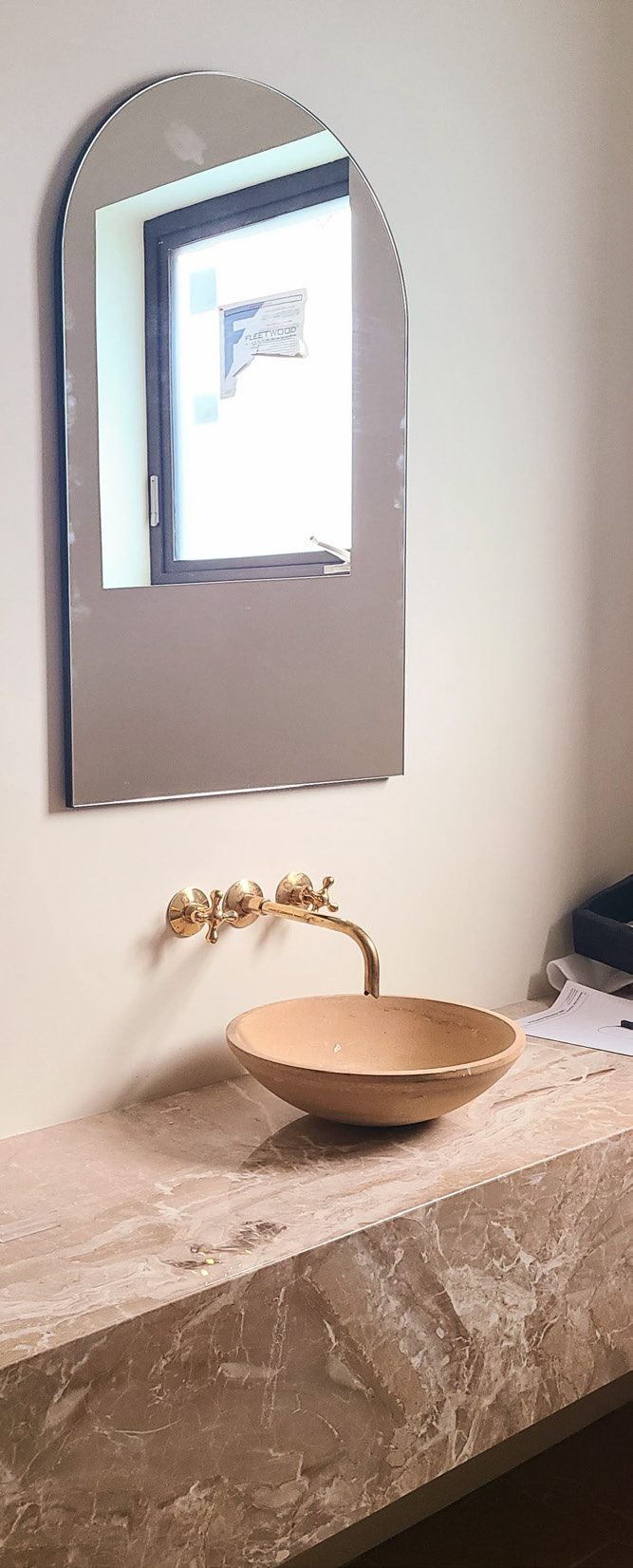 Arch mirror and brass vessel sink