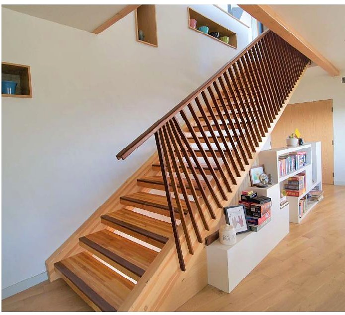 Timber slat staircase with built-in shelving